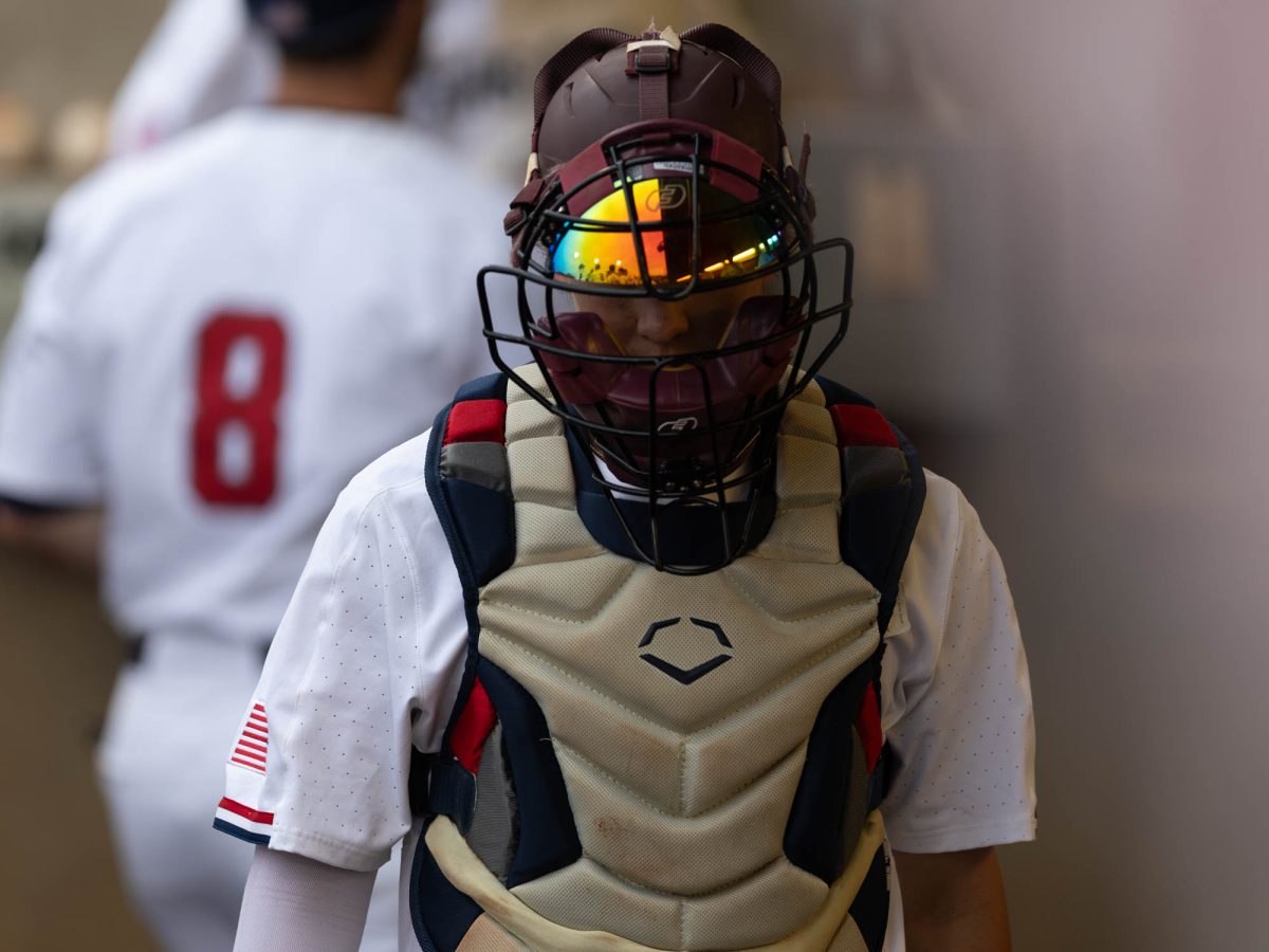 Texas A&amp;M catcher Hank Bard (48) walking in the dugout during Texas A&amp;M’s game against The United States Air Force Academy on Tuesday, April 16, 2024 at Olsen Field. (Hannah Harrison/The Battalion)