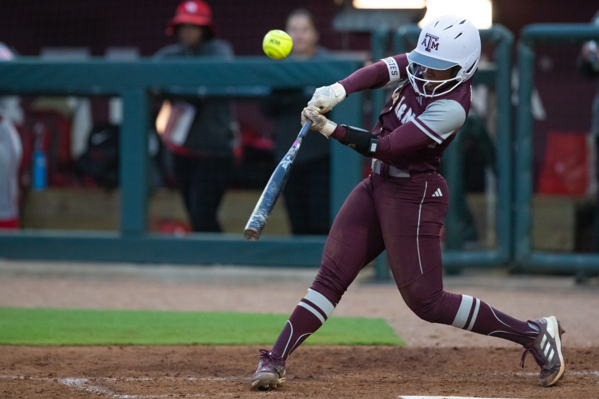 Texas A&amp;M infielder Koko Wooley (3) swings at the ball during Texas A&amp;M’s game against Houston at Davis Diamond. on Tuesday, April 23, 2024. (Rocio Salgado/ The Battalion)