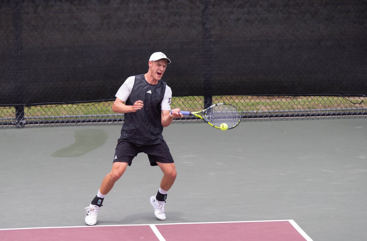 Senior Kenner Taylor returns the ball during Texas A&M’s match against Arkansas on Sunday, April 7, 2024 at Mitchell Tennis Center. (Lana Cheatham/The Battalion)