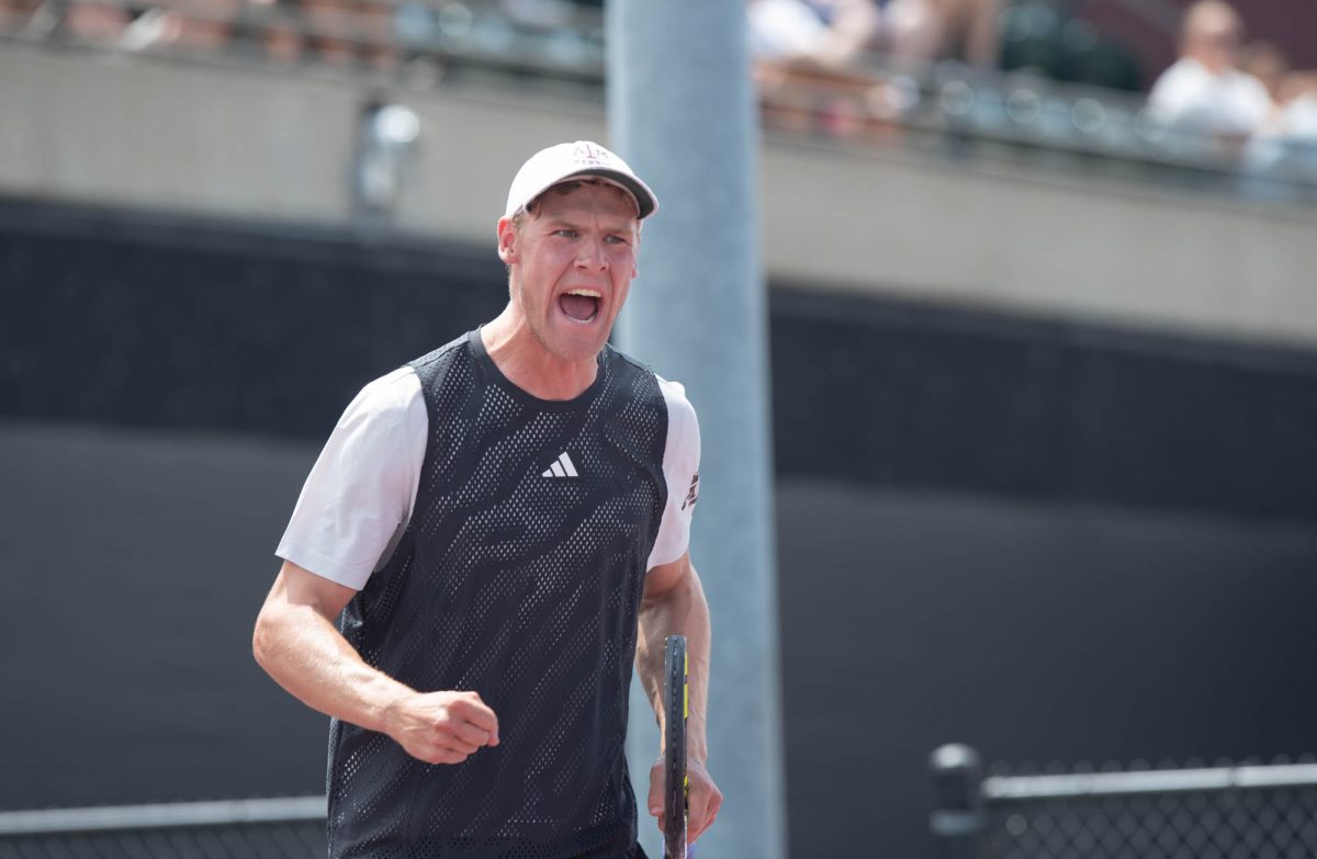 Senior Kenner Taylor reacts after scoring a point during Texas A&M’s match against Arkansas on Sunday, April 7, 2024 at Mitchell Tennis Center. (Lana Cheatham/The Battalion)