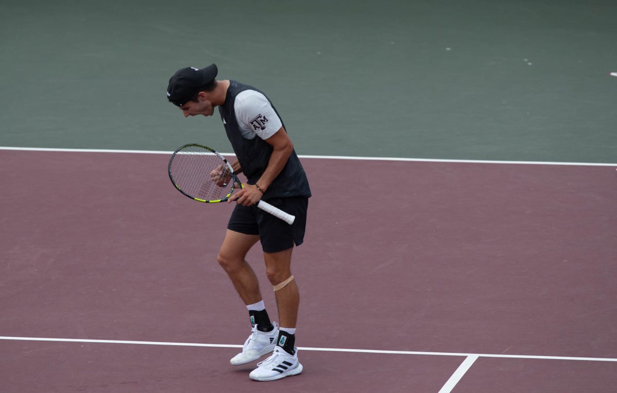 Junior Luke Casper reacts after scoring a point during Texas A&M’s match against Arkansas on Sunday, April 7, 2024 at Mitchell Tennis Center. (Lana Cheatham/The Battalion)