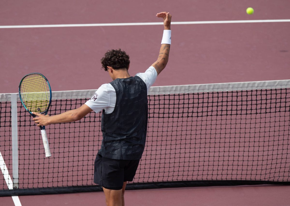 Freshman Tiago Pires reacts after scoring a point during Texas A&M’s match against Arkansas on Sunday, April 7, 2024 at Mitchell Tennis Center. (Lana Cheatham/The Battalion)