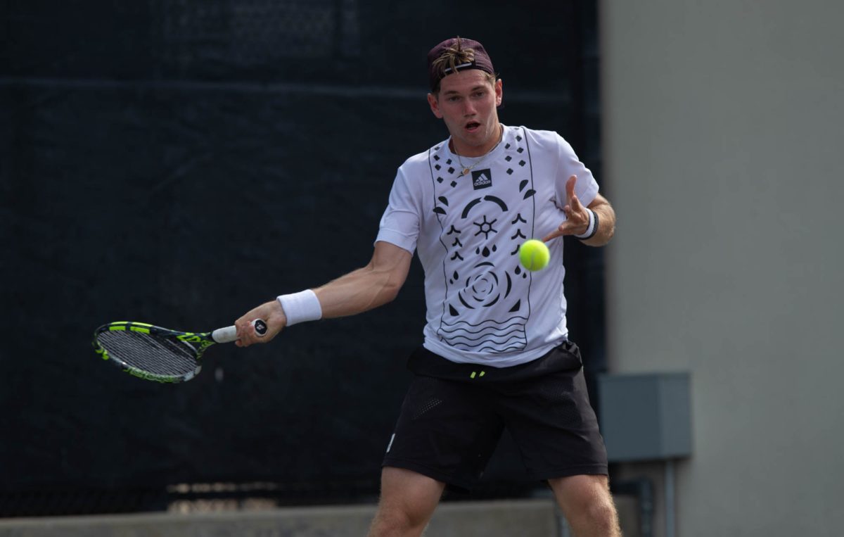 Freshman Grant Lothringer returns the ball during Texas A&M’s match against Arkansas on Sunday, April 7, 2024 at Mitchell Tennis Center. (Lana Cheatham/The Battalion)