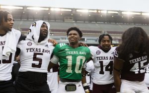 Freshman QB Marcel Reed (10) saws em off with senior DL Shemar Turner (5) and sophomore DB Jayvon Thomas (14) after Texas A&Ms Spring Game at Kyle Field on Saturday, April 20, 2024. (Adriano Espinosa/The Battalion)