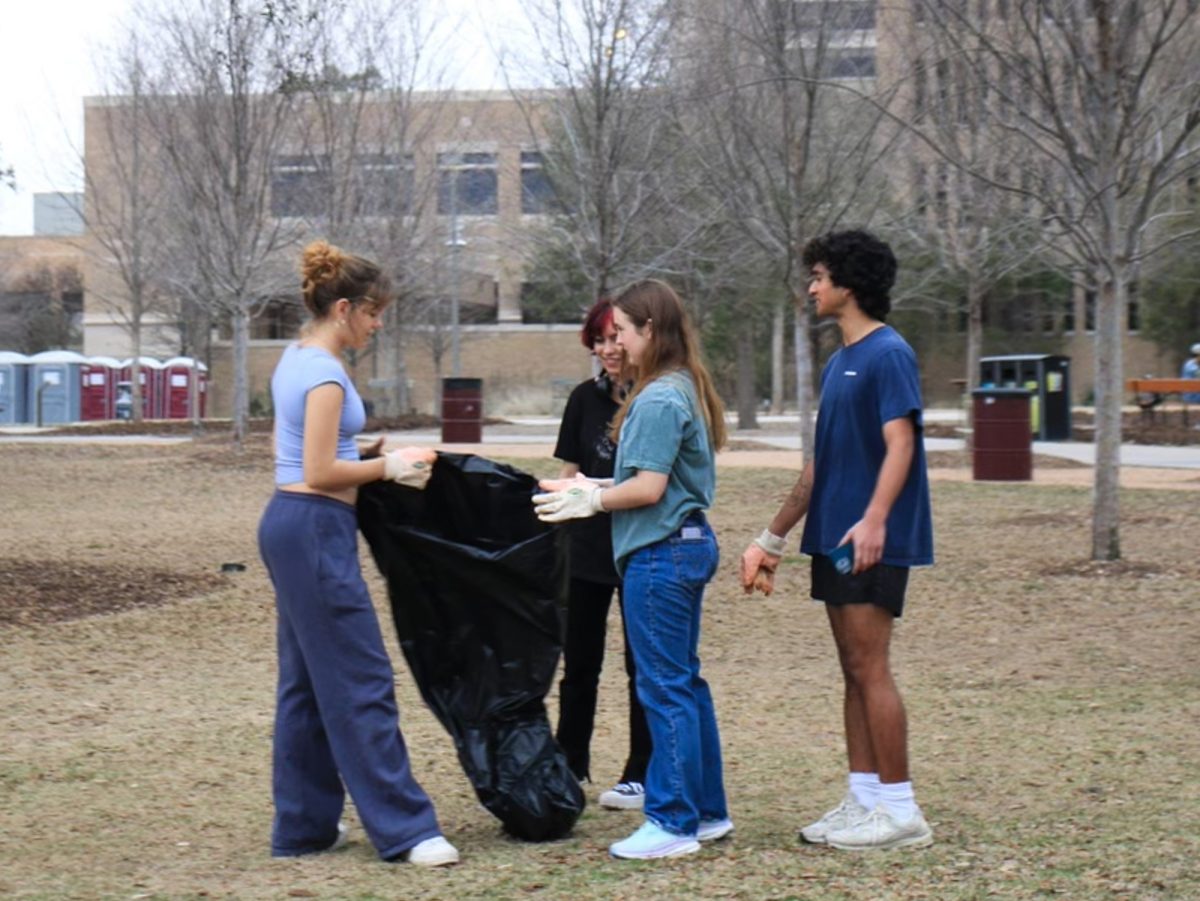 Members of Aggie Replant pick up trash at Aggie Park on Feb. 5, 2024. (Photo courtesy of Mayra Puga)