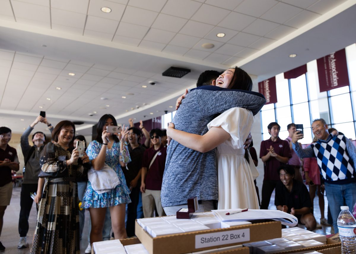 Allied health junior Yvonne Kim hugs her brother after receiving her Aggie Ring during the spring Ring Day at the Clayton W. Williams, Jr. Alumni Center on Thursday, April 11, 2024. (Kyle Heise/The Battalion)