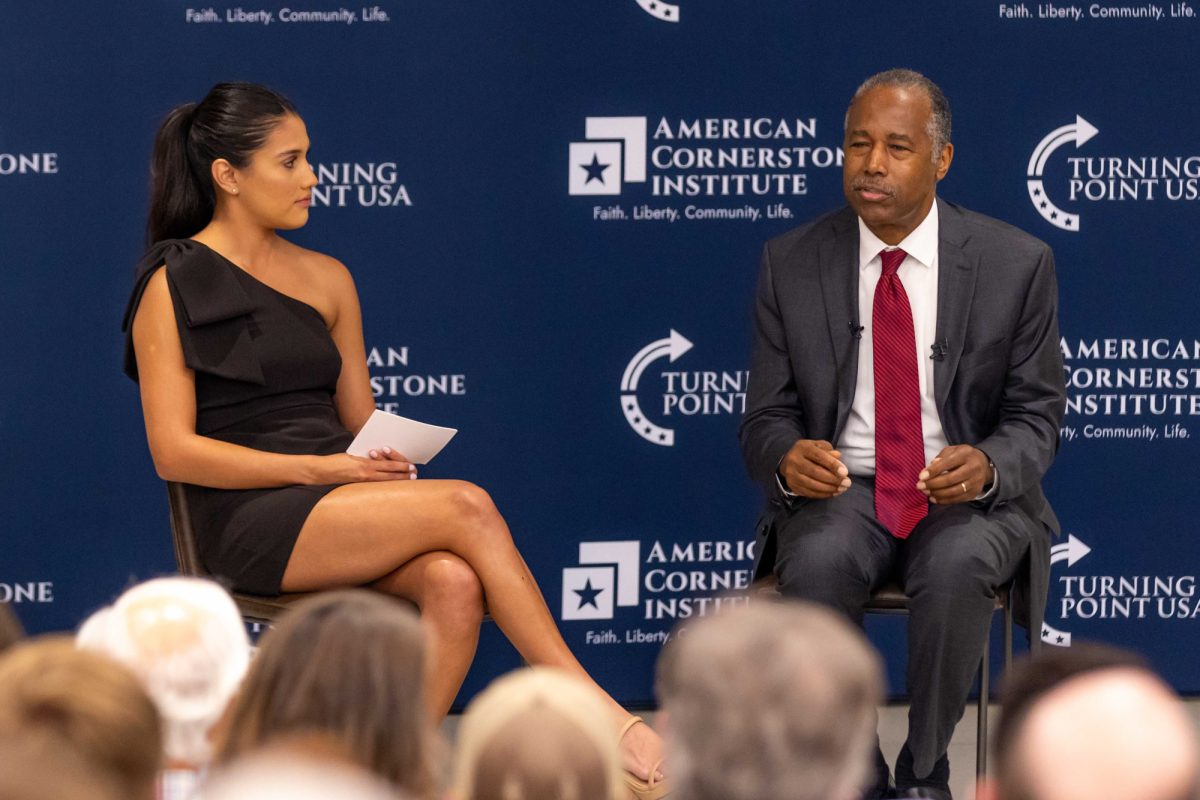 President of TPUSA at Texas A&M Crystal Amoles interviews Dr. Ben Carson during an event in the biological sciences building on April 18, 2024. (Samuel Falade/The Battalion)