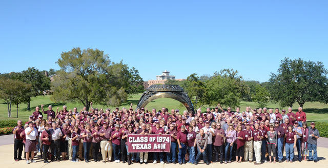 The Class of 1974 poses for a photo outside the Clayton W. Williams, Jr. Alumni Center for their 40 Year Reunion in 2014. (Photo courtesy of the Class of 1974)