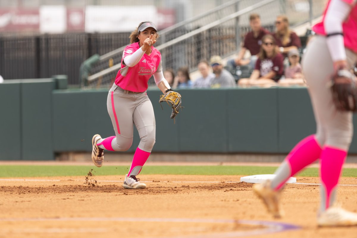 Sophomore INF Amari Harper (13) points as she runs in during Texas A&Ms game against Kentucky on April 7th, 2024 at Davis Diamond. (Jaime Rowe/The Battalion)