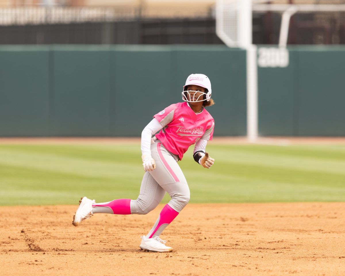 Junior INF Koko Wooley (3) looks at second base as she runs back to first during Texas A&Ms game against Kentucky on April 7th, 2024 at Davis Diamond. (Jaime Rowe/The Battalion)