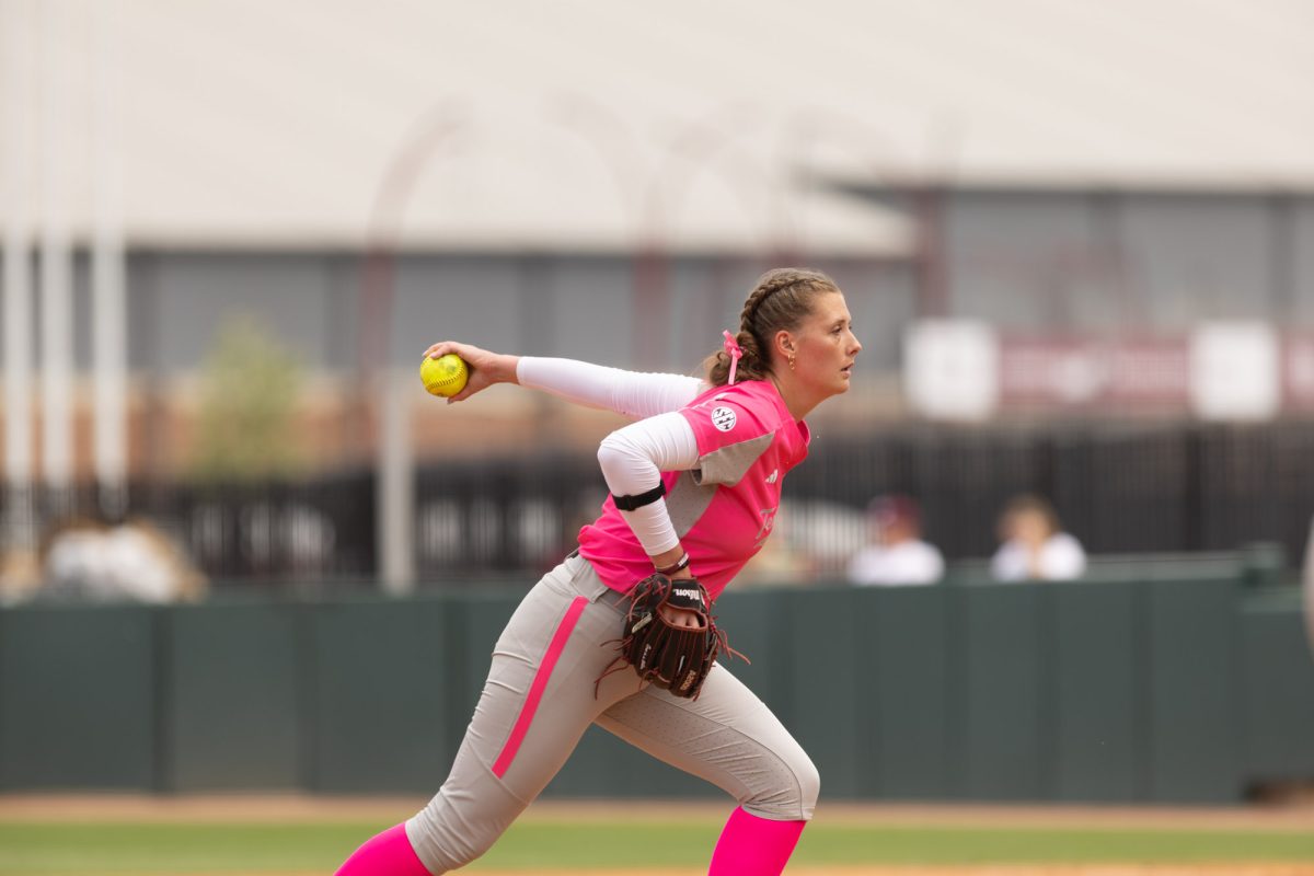 Junior P Emily Kennedy (11) winds up to pitch during Texas A&Ms game against Kentucky on April 7th, 2024 at Davis Diamond. (Jaime Rowe/The Battalion)
