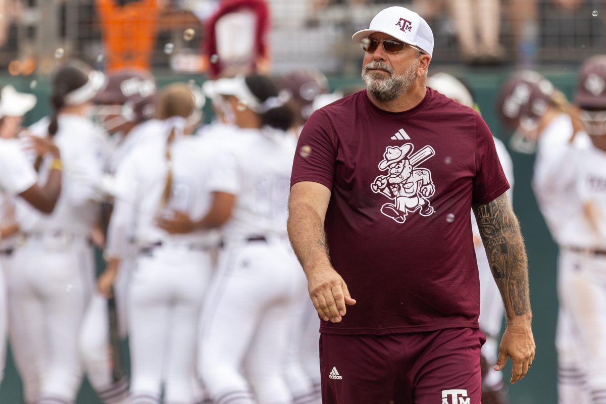 Texas A&M assistant coach Russ Heffley walks through bubbles during Texas A&M’s game against Texas at the Austin Super Regional at Red and Charline McCombs Field in Austin, Texas, on Friday, May 24, 2024. (CJ Smith/The Battalion)