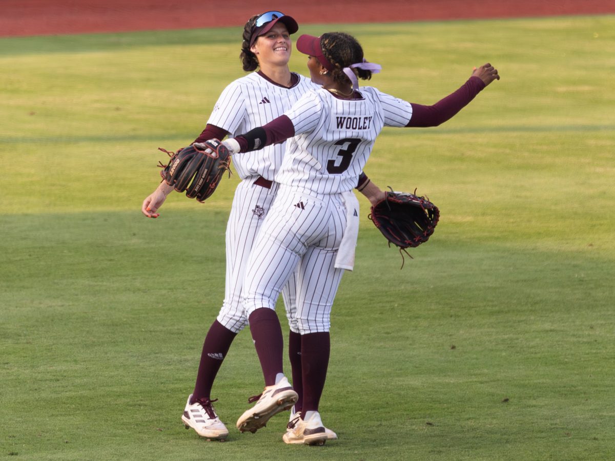 Texas A&M outfielder Kramer Eschete (91) and infielder Koko Wooley (3) react during Texas A&M’s game against Texas at the Austin Super Regional at Red and Charline McCombs Field in Austin, Texas, on Sunday, May 26, 2024. (CJ Smith/The Battalion)