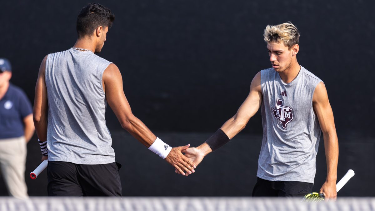 Sophomore Togan Tokac and junior Giulio Perego shake hands during Texas A&amp;M’s match against Rice at the NCAA Men’s Tennis Regional at Mitchell Tennis Center on Friday, May 3, 2024. (CJ Smith/The Battalion)