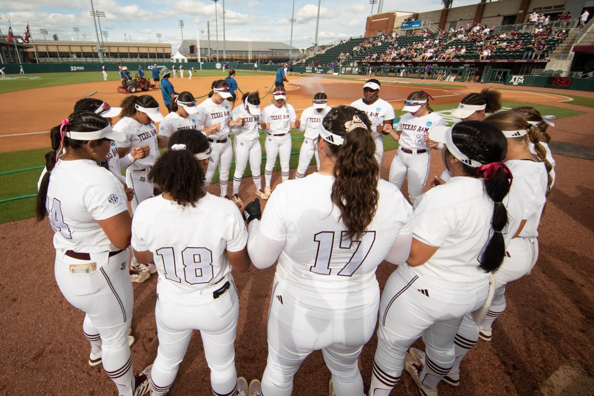 The Texas A&amp;M team prays during Texas A&amp;M’s game against Albany at the first round of the NCAA Women’s College World Series at Davis Diamond on Friday, May 18, 2024. (Hannah Harrison/The Battalion)