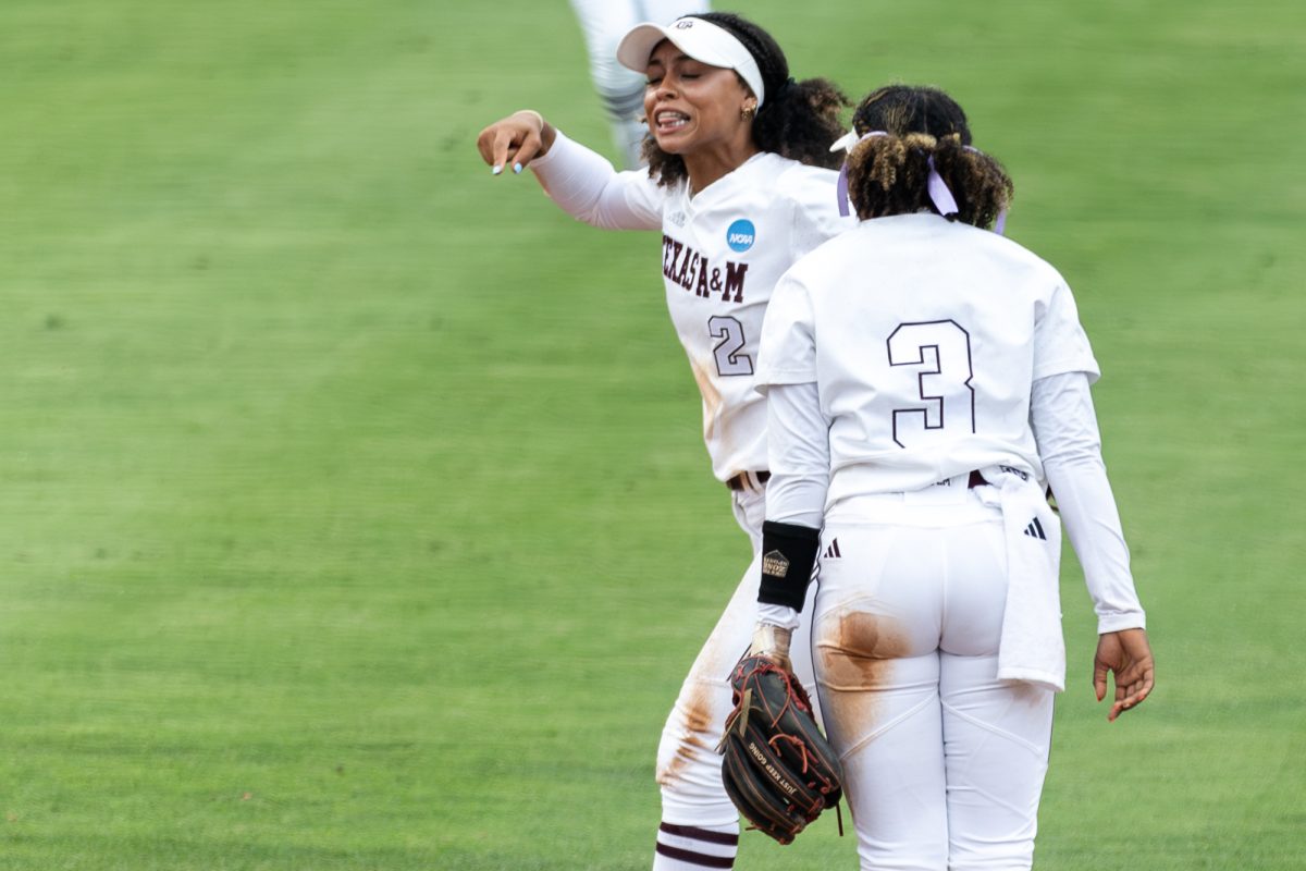 Texas A&M infielder Rylen Wiggins (2) and infielder Koko Wooley (3) react during Texas A&M’s game against Texas at the Austin Super Regional at Red and Charline McCombs Field in Austin, Texas, on Friday, May 24, 2024. (CJ Smith/The Battalion)