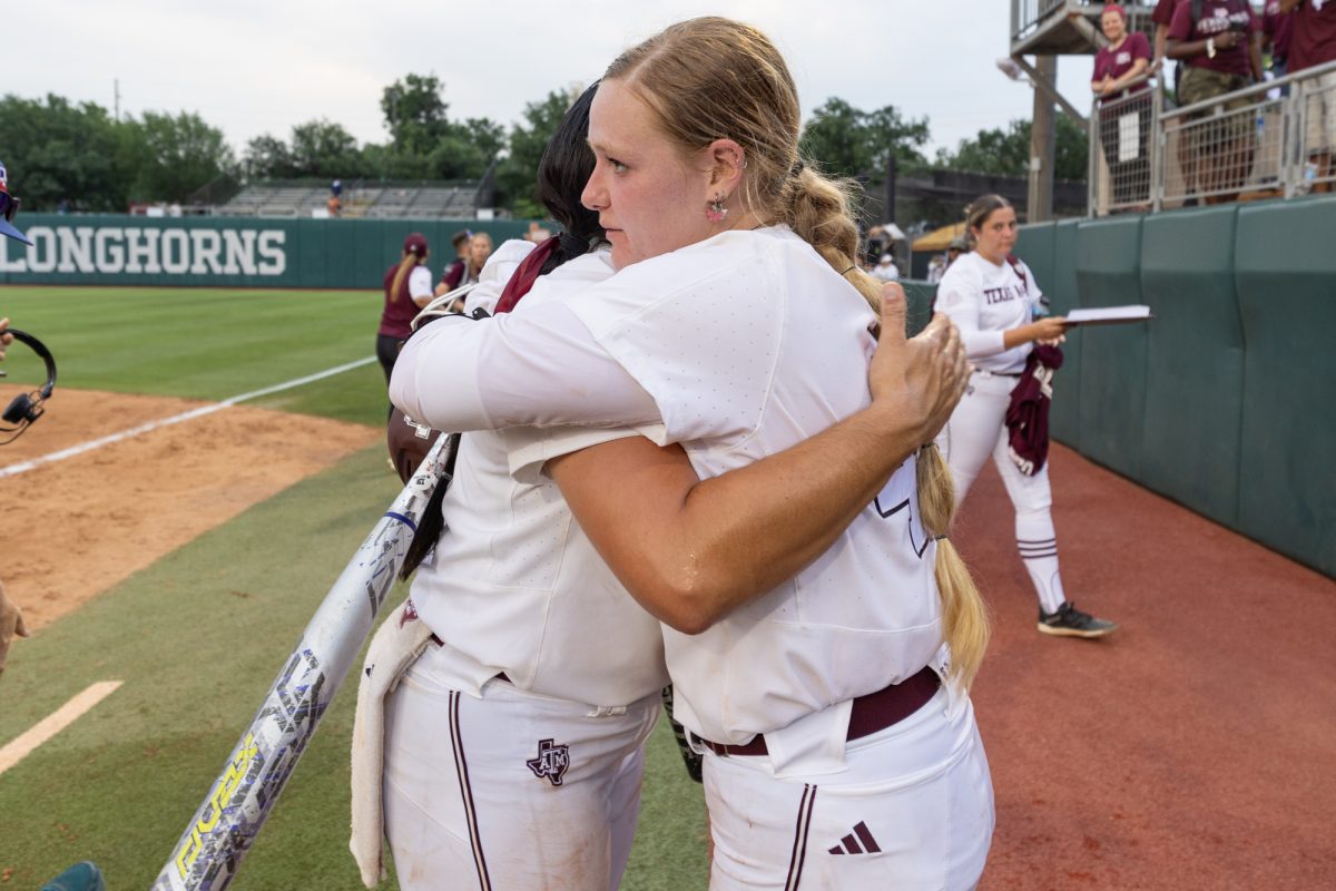 Texas A&M catcher Julia Cottrill (42) hugs infielder Trinity Cannon (6) after Texas A&M’s game against Texas at the Austin Super Regional at Red and Charline McCombs Field in Austin, Texas, on Friday, May 24, 2024. (CJ Smith/The Battalion)