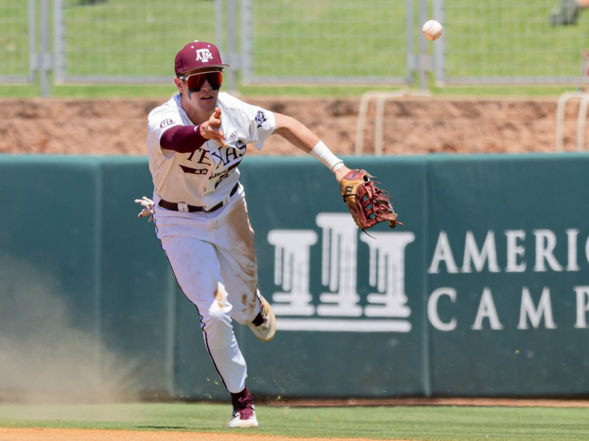 Texas A&M infielder Ted Burton (27) throws a ball for an out during Texas A&M’s game against Grambling State at the NCAA Bryan-College Station Regional at Olsen Field on Friday, May 31, 2024. (Hannah Harrison/The Battalion)
