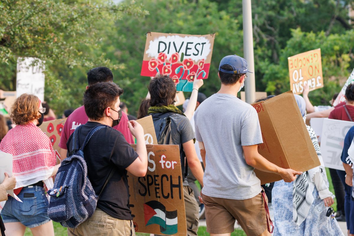 Demostrators walk back towards Rudder tower during the free Palestine protest on May 7, 2024. (Samuel Falade/The Battalion)