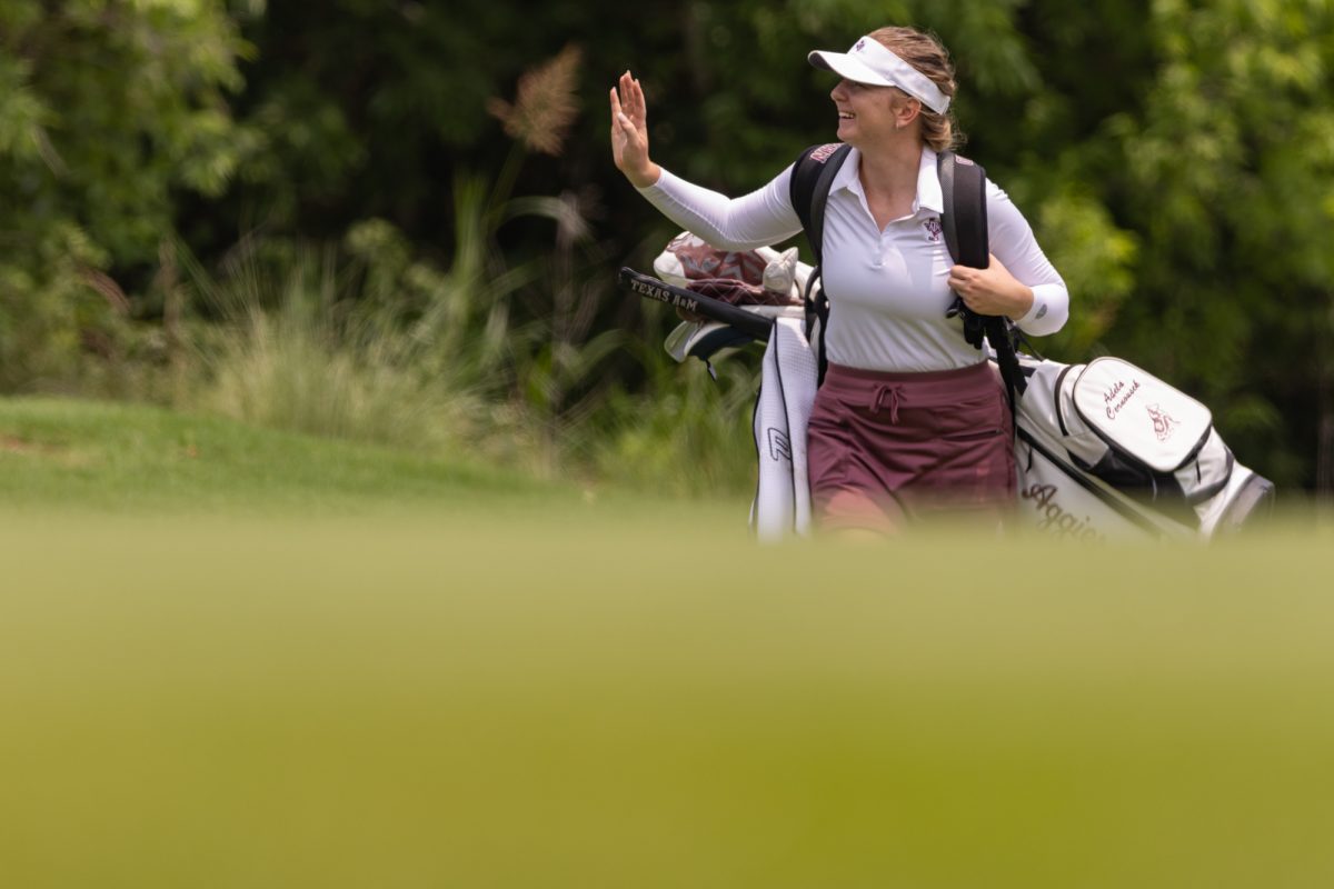 Junior Adela Cernousek waves at fans during the Bryan Regional of the NCAA Women’s Golf Championship at Traditions Golf Club on Monday, May 6, 2024. (Chris Swann/ The Battalion)