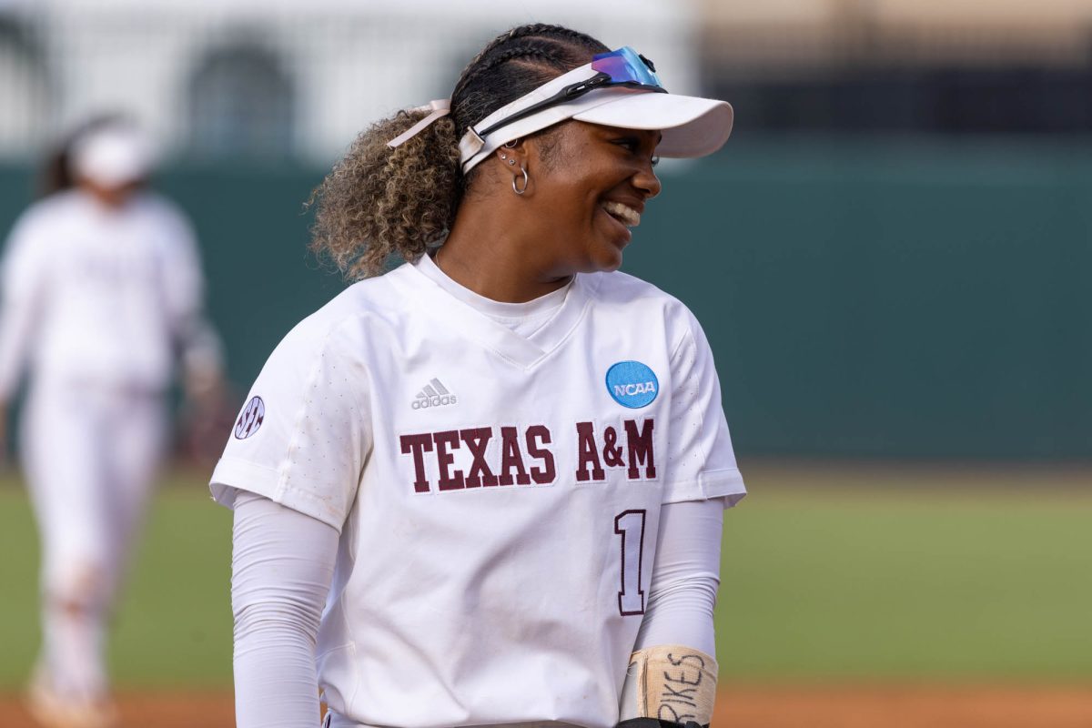 Texas A&amp;M infielder Kennedy Powell (1) laughs during Texas A&amp;M’s game against UAlbany at the first round of the NCAA Women’s College World Series at Davis Diamond on Friday, May 18, 2024. (Hannah Harrison/The Battalion)