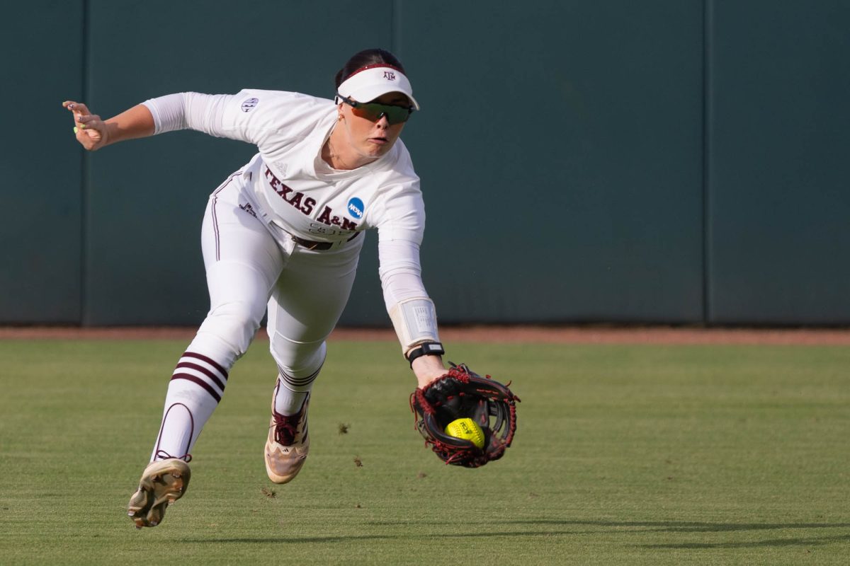 Texas A&M outfielder Allie Enright (33) makes a diving catch during Texas A&M’s game against Albany at the first round of the NCAA Women’s College World Series at Davis Diamond on Friday, May 18, 2024. (Hannah Harrison/The Battalion)