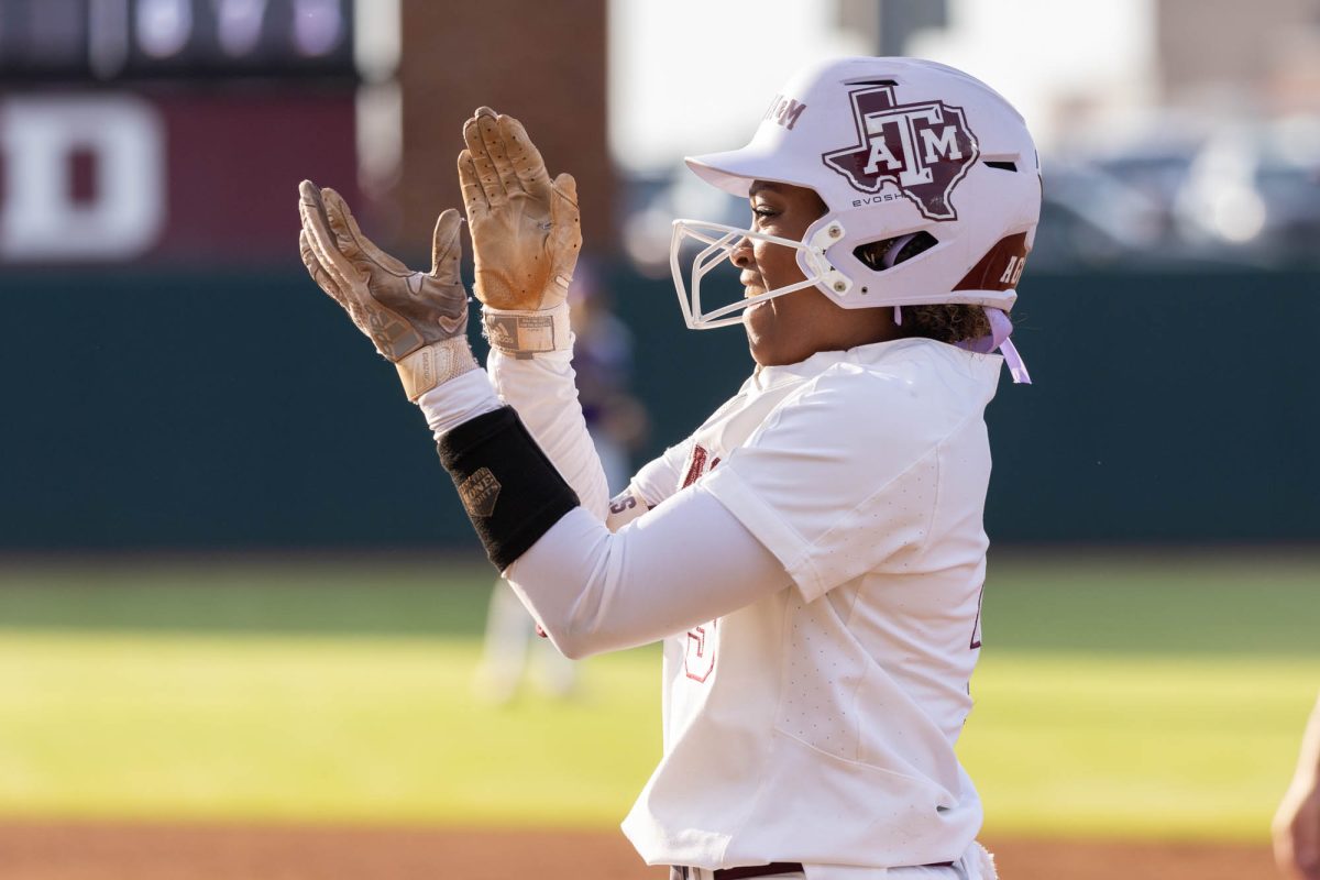 Texas A&amp;M infielder Koko Wooley (3) celebrates getting on base during Texas A&amp;M’s game against UAlbany at the first round of the NCAA Women’s College World Series at Davis Diamond on Friday, May 18, 2024. (Hannah Harrison/The Battalion)