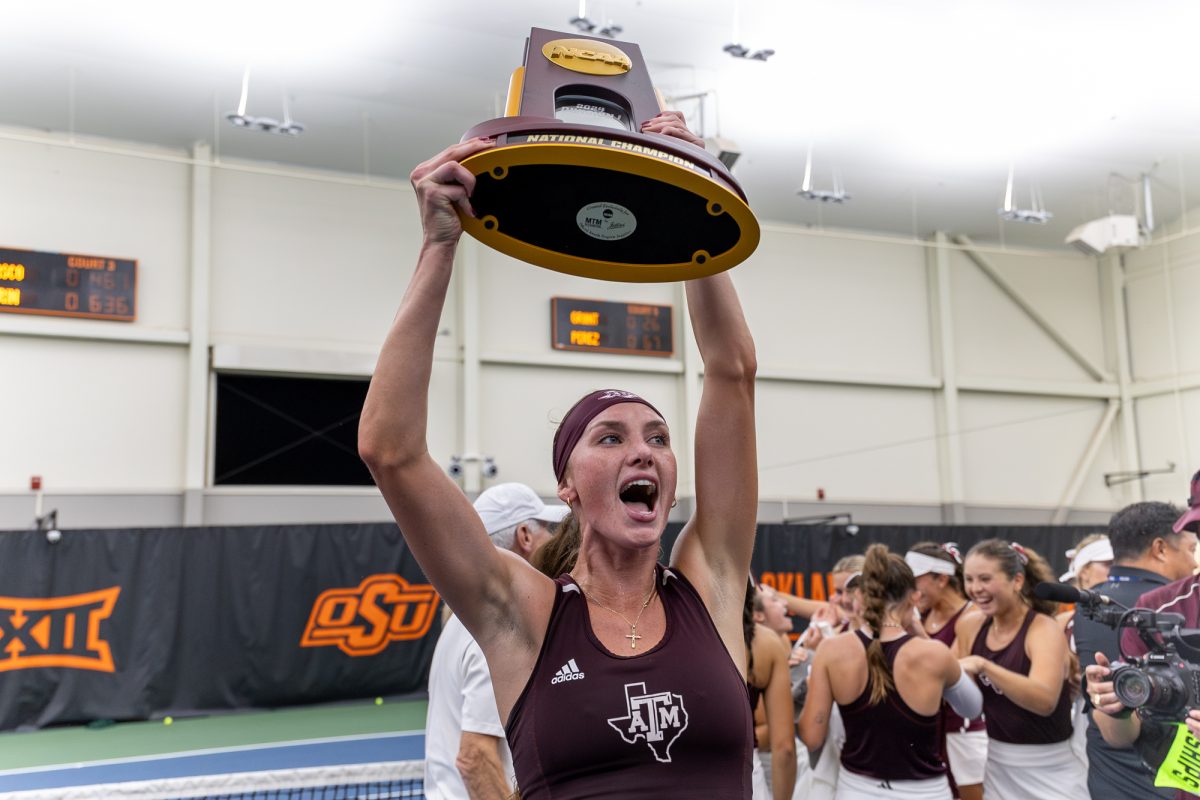 Texas A&M senior Carson Brandstine reacts after receiving the National Championship trophy after Texas A&M’s win against Georgia at the NCAA Women’s Tennis Championship Game in Greenwood Tennis Center in Stillwater, Oklahoma, on Sunday, May 19, 2024. (CJ Smith/The Battalion)