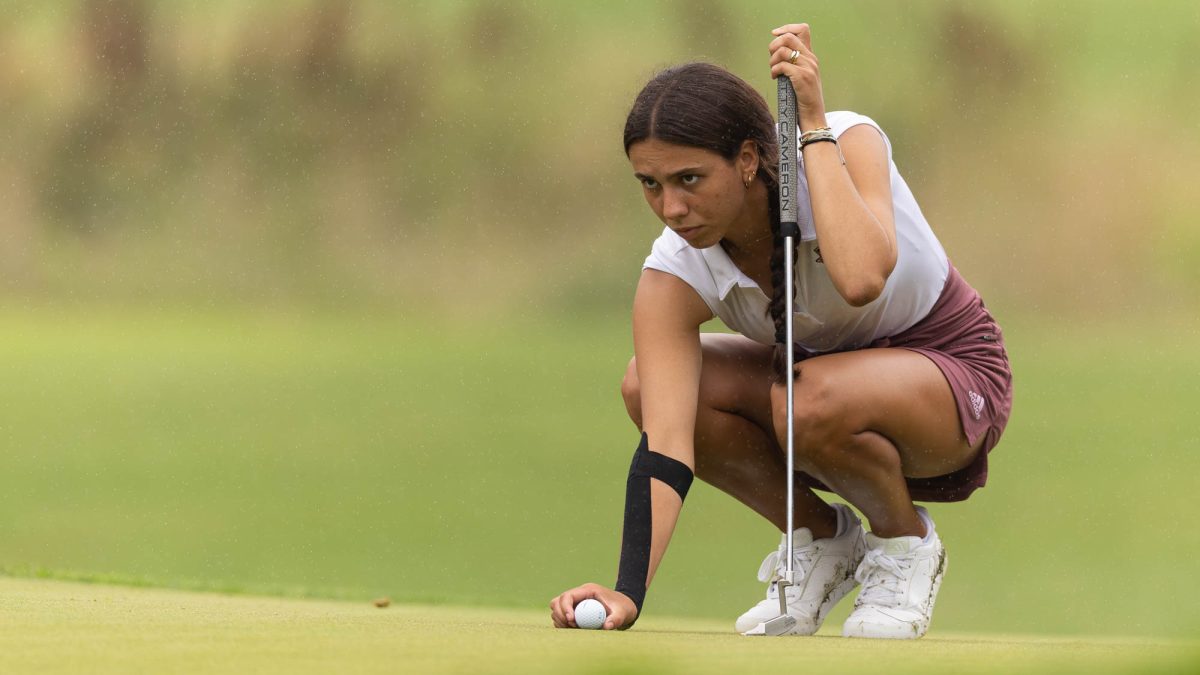 Freshman Cayetana Fernández García-Poggio appears to put in the rain during the Bryan Regional of the NCAA Women’s Golf Championship at Traditions Golf Club on Monday, May 6, 2024. (Hannah Harrison/The Battalion)