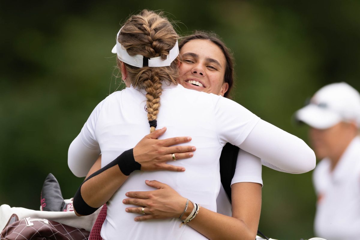 Texas A&amp;M sophomore Cayetana Fernández García-Poggio hugs Texas A&amp;M senior Adela Cernousek after completing the course during the Bryan Regional of the NCAA Women’s Golf Championship at Traditions Golf Club on Monday, May 6, 2024. (Hannah Harrison/The Battalion)