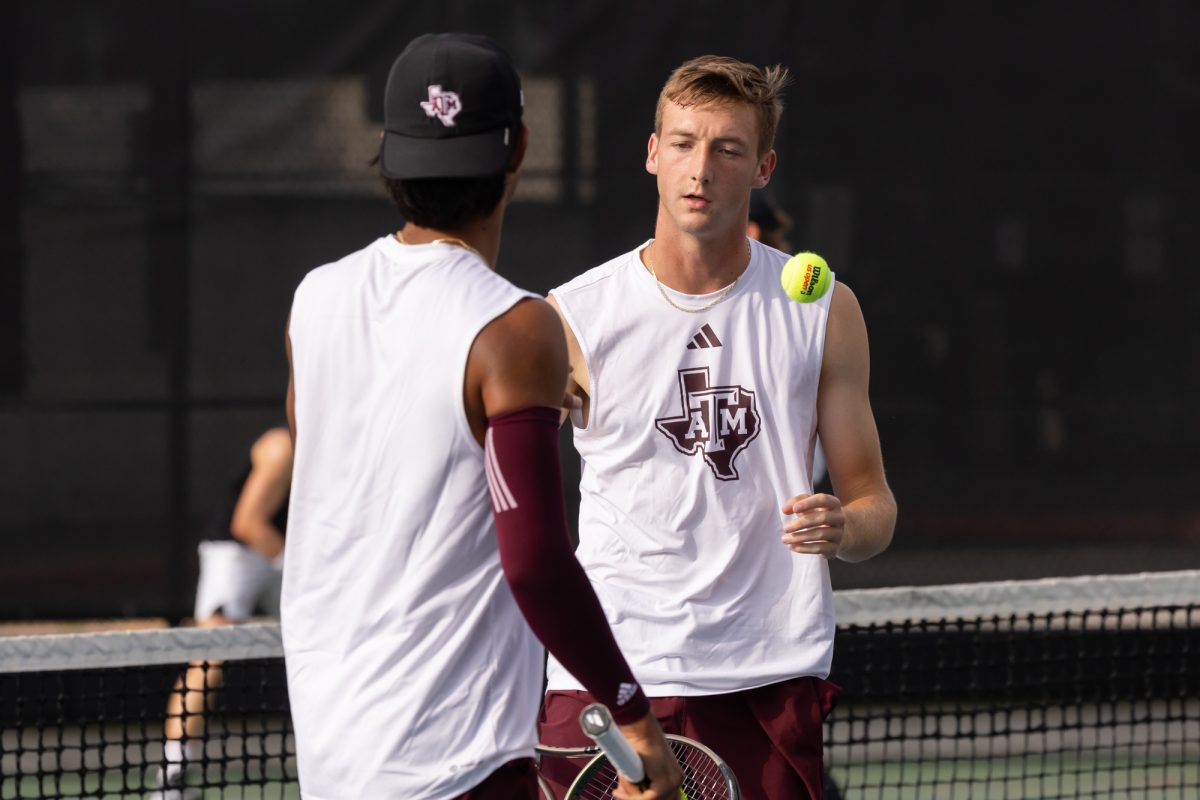 Freshman Lathan Skrobarcek talks to Junior JC Roddick during Texas A&amp;M’s match against Texas at Texas Tennis Center in Austin on Friday, May 10, 2024. (Chris Swann/The Battalion)