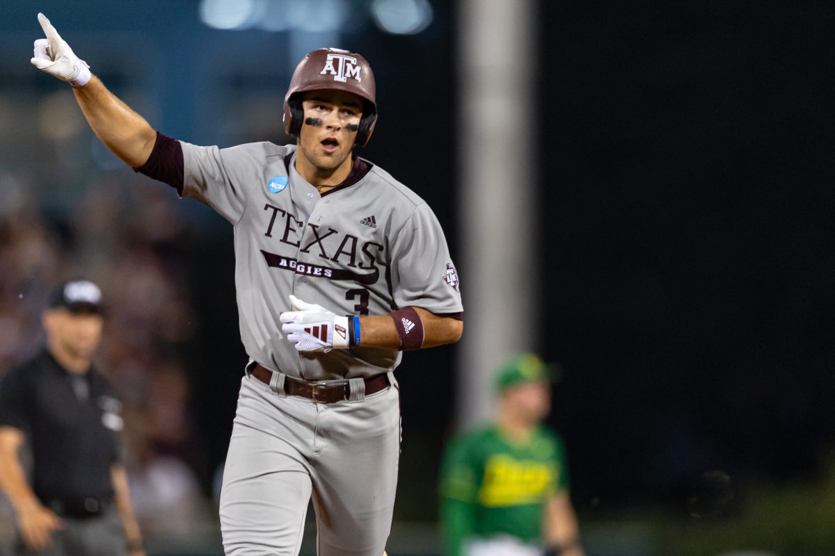 Texas A&M infielder Kaeden Kent (3) reacts after hitting a grand-slam to take the lead during Texas A&M’s game against Oregon at the NCAA Bryan-College Station Super Regional at Olsen Field on Sunday, June 9, 2024. (CJ Smith/The Battalion)