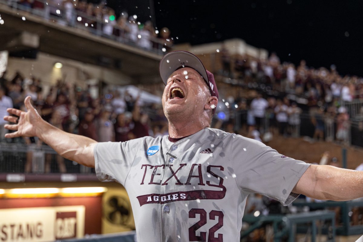 Texas A&M head coach Jim Schlossnagle celebrates after The Aggies win the NCAA Bryan-College Station Super Regional at Olsen Field on Sunday, June 9, 2024. (CJ Smith/The Battalion)