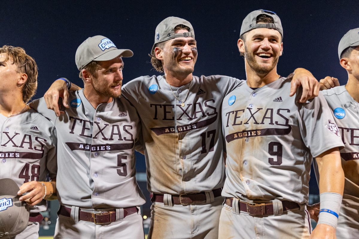 Texas A&M outfielder Hayden Schott (5), outfielder Jace Laviolette (17), and utility Gavin Grahovac (9) hug after The Aggies win the NCAA Bryan-College Station Super Regional at Olsen Field on Sunday, June 9, 2024. (CJ Smith/The Battalion)