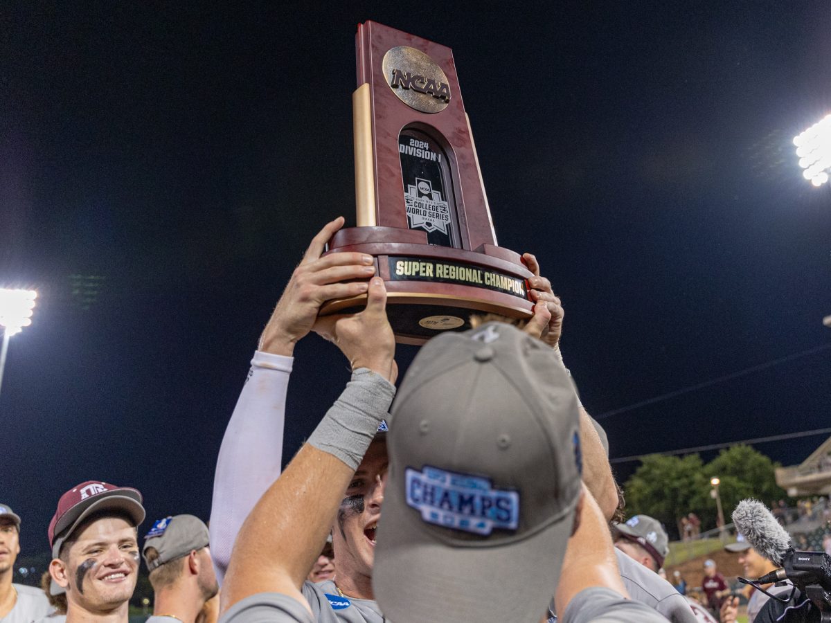 The Aggies hold their trophy after they win the NCAA Bryan-College Station Super Regional at Olsen Field on Sunday, June 9, 2024. (CJ Smith/The Battalion)