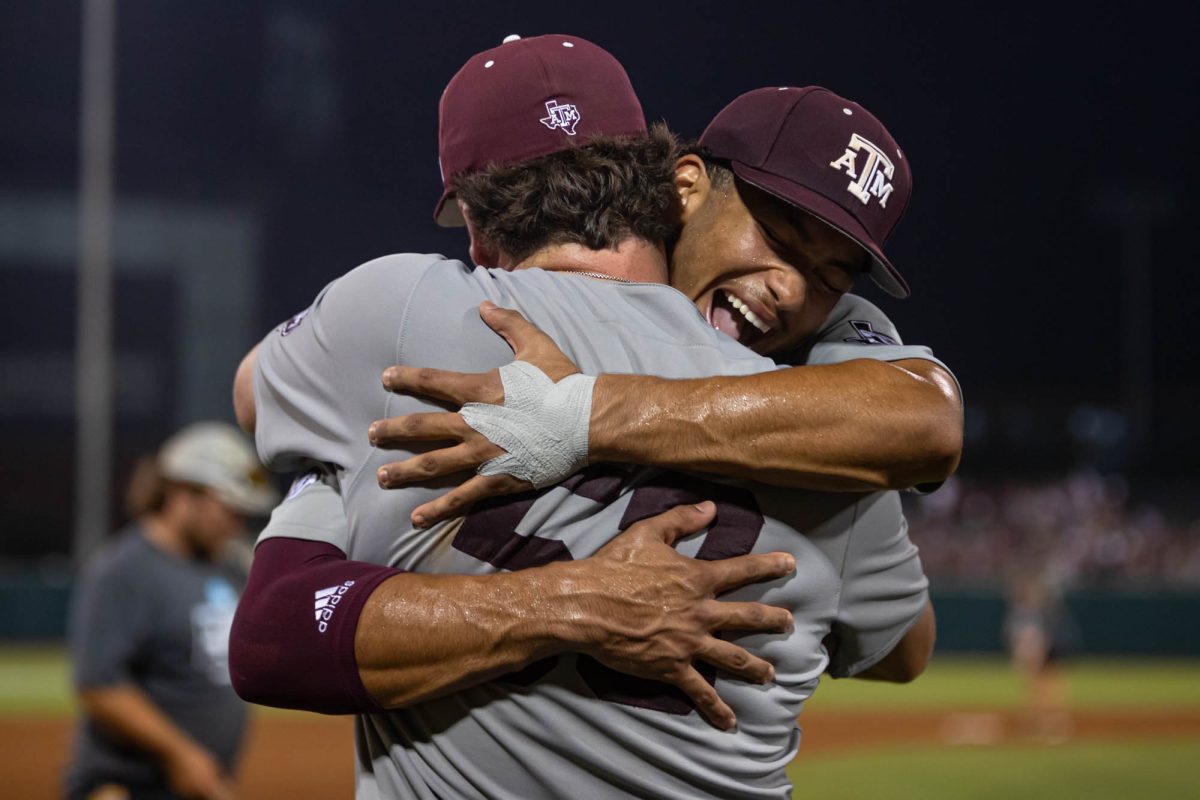 Texas A&M outfielder Braden Montgomery (6) hugs Texas A&M pitcher Evan Aschenbeck (53) during Texas A&M’s game against Texas at the NCAA Bryan-College Station Regional at Olsen Field on Saturday, June 1, 2024. (Hannah Harrison/The Battalion)
