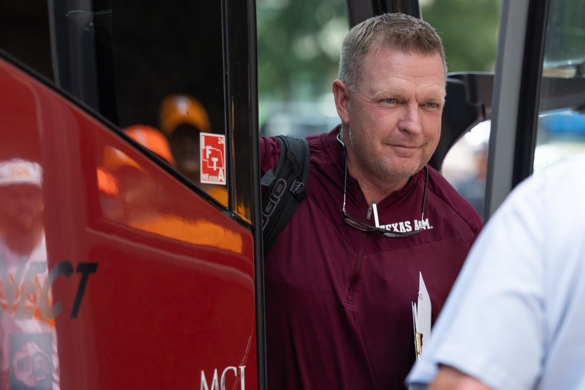 Texas A&M head coach Jim Schlossnagle (22) walks out of the team bus before Texas A&M’s game against Tennessee at the NCAA Men’s College World Series finals at Charles Schwab Field in Omaha, Nebraska on Saturday, June 22, 2024. (Chris Swann/The Battalion)