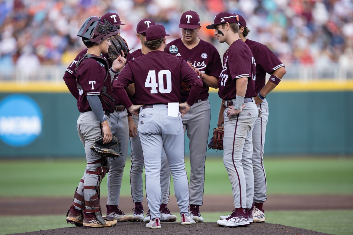 Texas A&M assistant coach Max Weiner (40) visits the mound during Texas A&M’s game against Florida at the NCAA Men’s College World Series semifinals at Charles Schwab Field in Omaha, Nebraska on Wednesday, June 19, 2024. (Chris Swann/The Battalion)