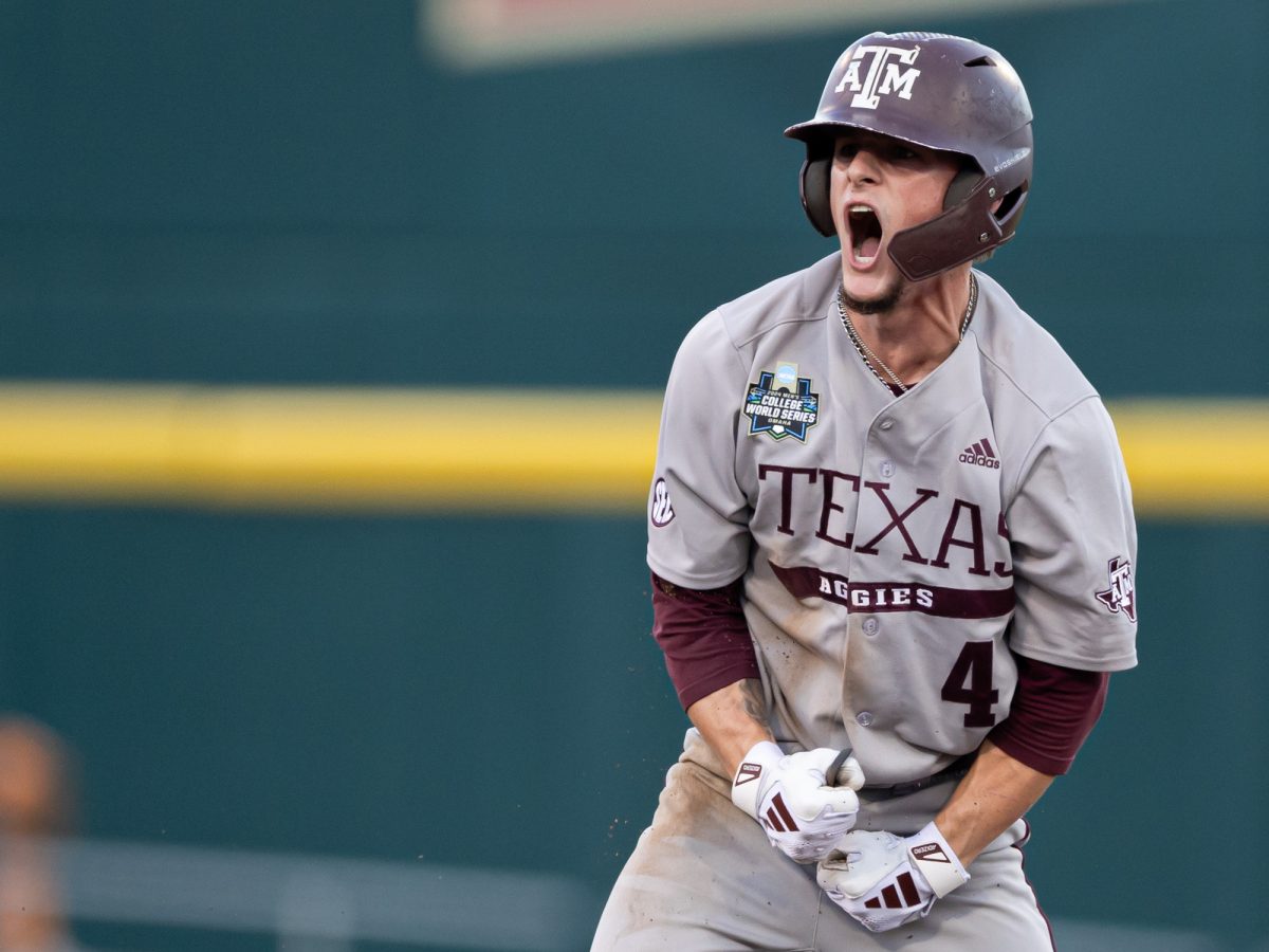 Texas A&M infielder Travis Chestnut (4) reacts after stealing second base during Texas A&M’s game against Tennessee at the NCAA Men’s College World Series finals at Charles Schwab Field in Omaha, Nebraska on Saturday, June 22, 2024. (Chris Swann/The Battalion)