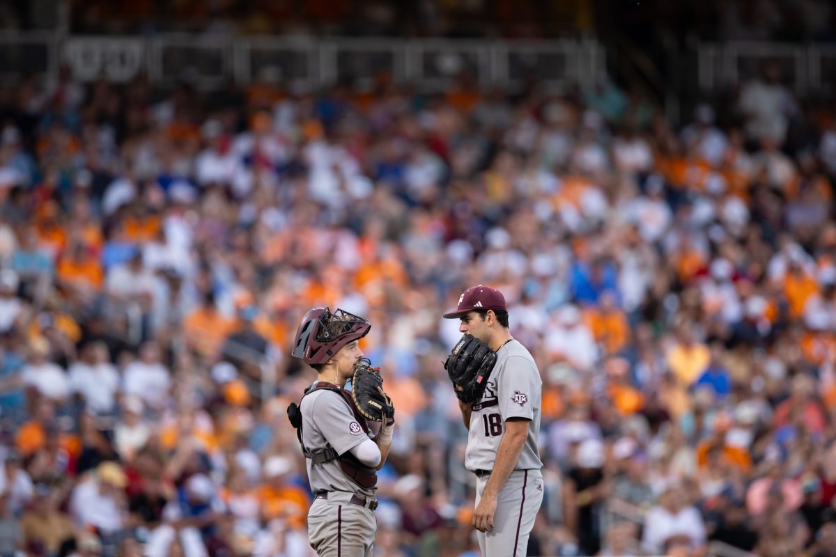 Texas A&M catcher Jackson Appel (20) and Texas A&M pitcher Ryan Prager (18) talks on the mound during Texas A&M’s game against Tennessee at the NCAA Men’s College World Series finals at Charles Schwab Field in Omaha, Nebraska on Saturday, June 22, 2024. (Chris Swann/The Battalion)