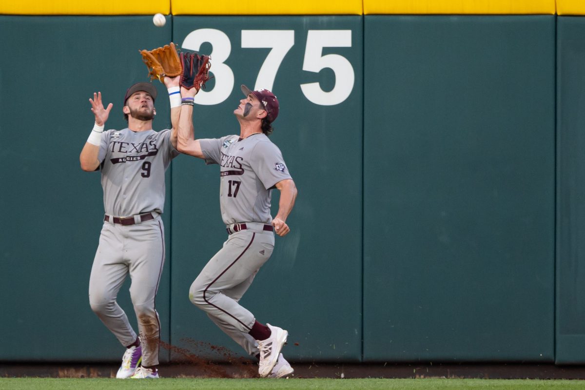 Texas A&M utility Gavin Grahovac (9) and outfielder Jace Laviolette (17) contest for a catch during Texas A&M’s game against Tennessee at the NCAA Men’s College World Series finals at Charles Schwab Field in Omaha, Nebraska on Monday, June 24, 2024. (Chris Swann/The Battalion)