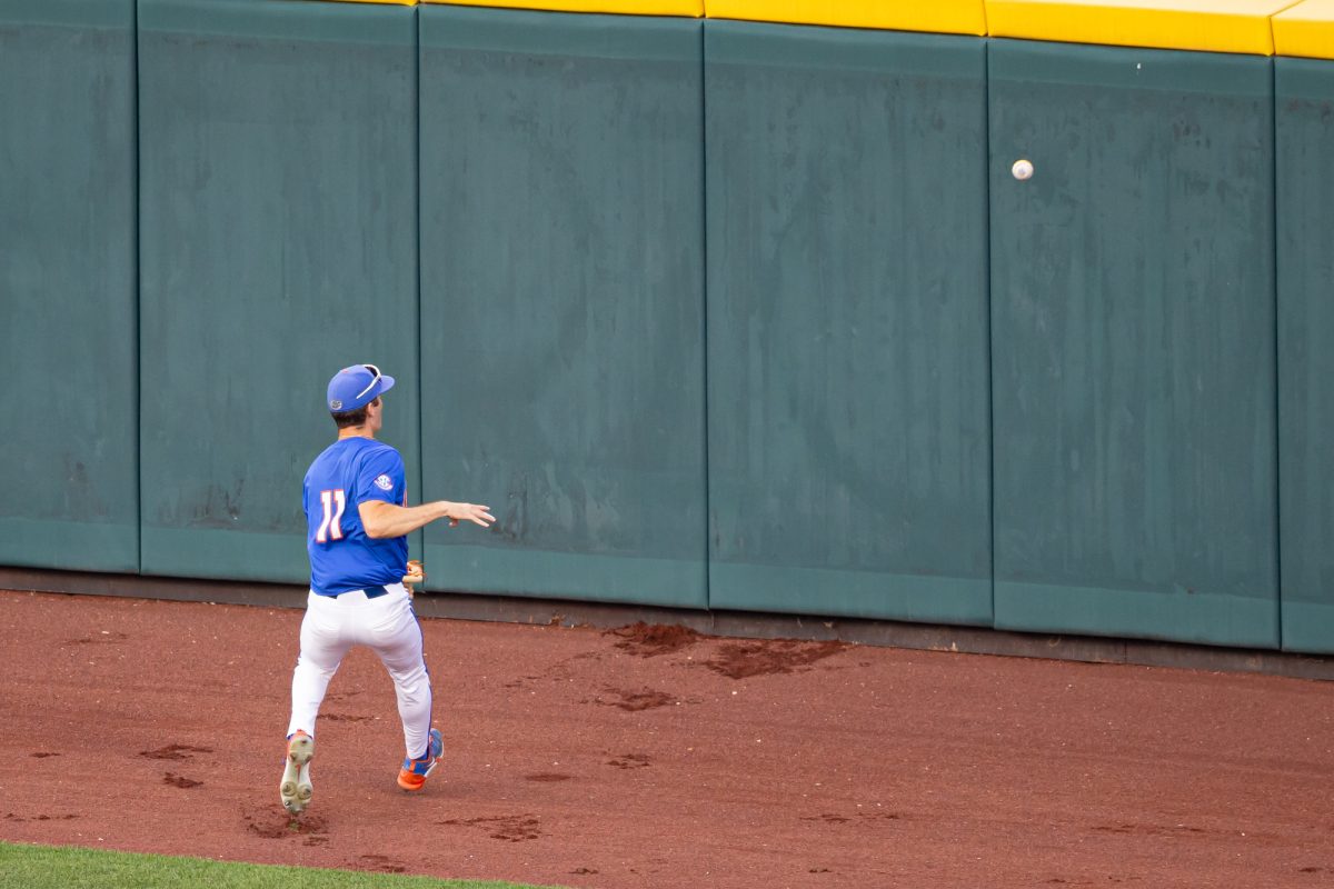 Florida outfielder Michael Robertson (11) watches the ball bounce off the outfielld wall during Texas A&M’s game against Florida at the NCAA Men’s College World Series semifinals at Charles Schwab Field in Omaha, Nebraska on Wednesday, June 19, 2024. (Chris Swann/The Battalion)