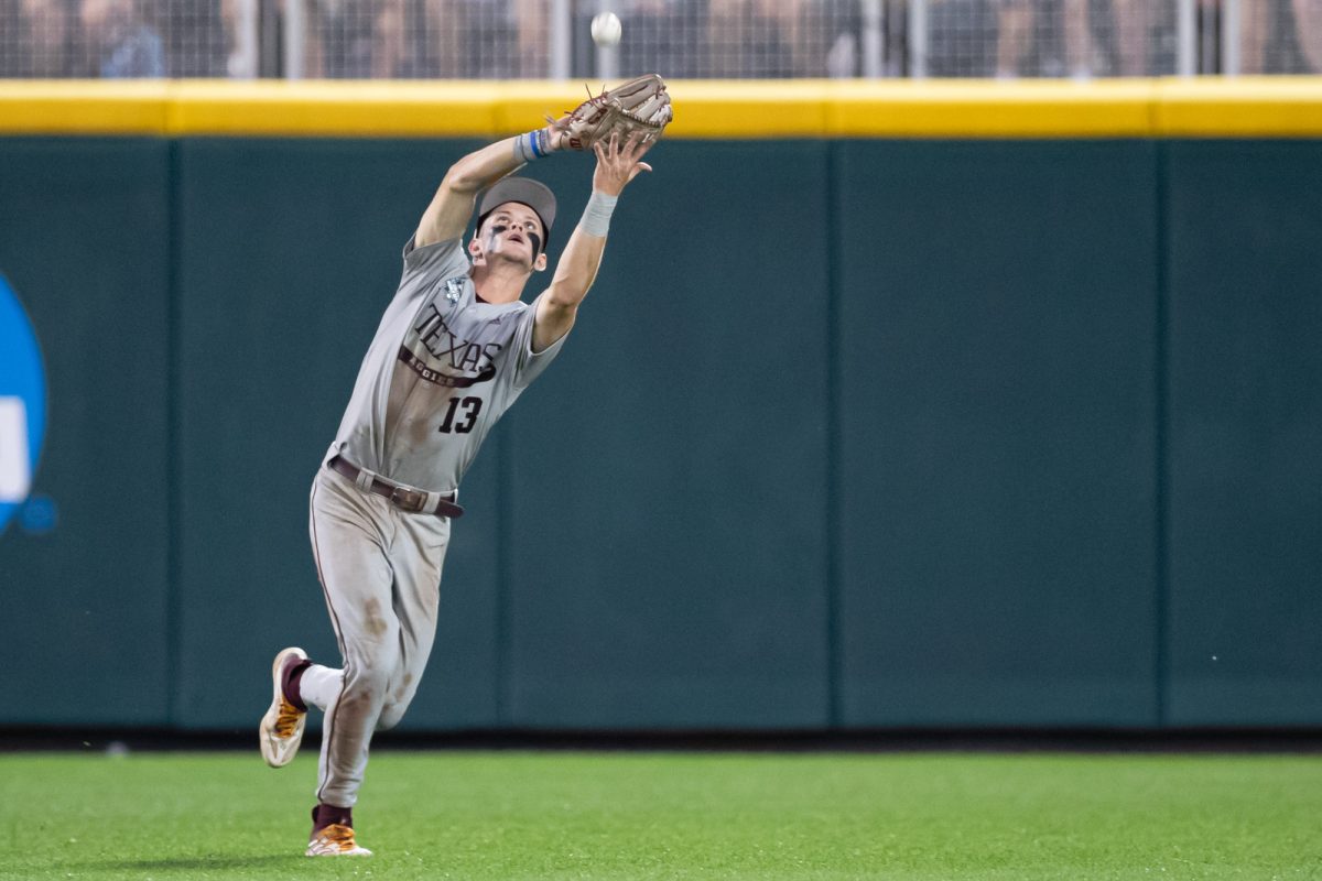 Texas A&M outfielder Caden Sorrell (13) catches a pop fly during Texas A&M’s game against Tennessee at the NCAA Men’s College World Series finals at Charles Schwab Field in Omaha, Nebraska on Saturday, June 22, 2024. (Chris Swann/The Battalion)