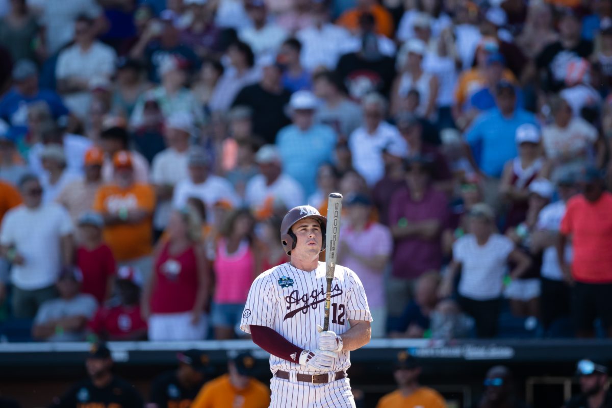 Texas A&M infielder Ryan Targac (12) takes a breath before stepping up to the plate during Texas A&M’s game against Tennessee at the NCAA Men’s College World Series finals at Charles Schwab Field in Omaha, Nebraska on Saturday, June 22, 2024. (Chris Swann/The Battalion)