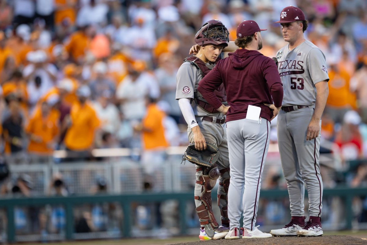 Texas A&M assistant coach Max Weiner (40) visits the mound during Texas A&M’s game against Tennessee at the NCAA Men’s College World Series finals at Charles Schwab Field in Omaha, Nebraska on Monday, June 24, 2024. (Chris Swann/The Battalion)