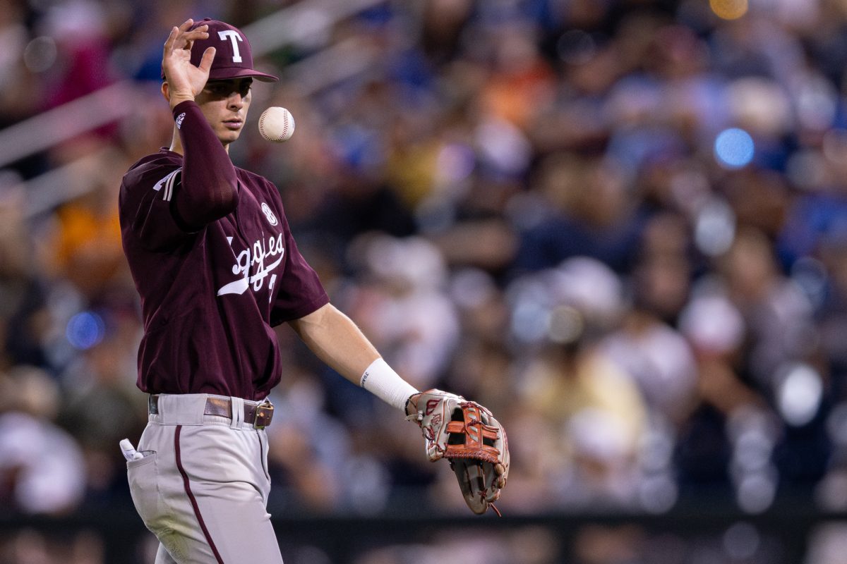 Texas A&M infielder Ali Camarillo (2) tosses the ball during Texas A&M’s game against Florida at the NCAA Men’s College World Series semifinals at Charles Schwab Field in Omaha, Nebraska on Wednesday, June 19, 2024. (Chris Swann/The Battalion)