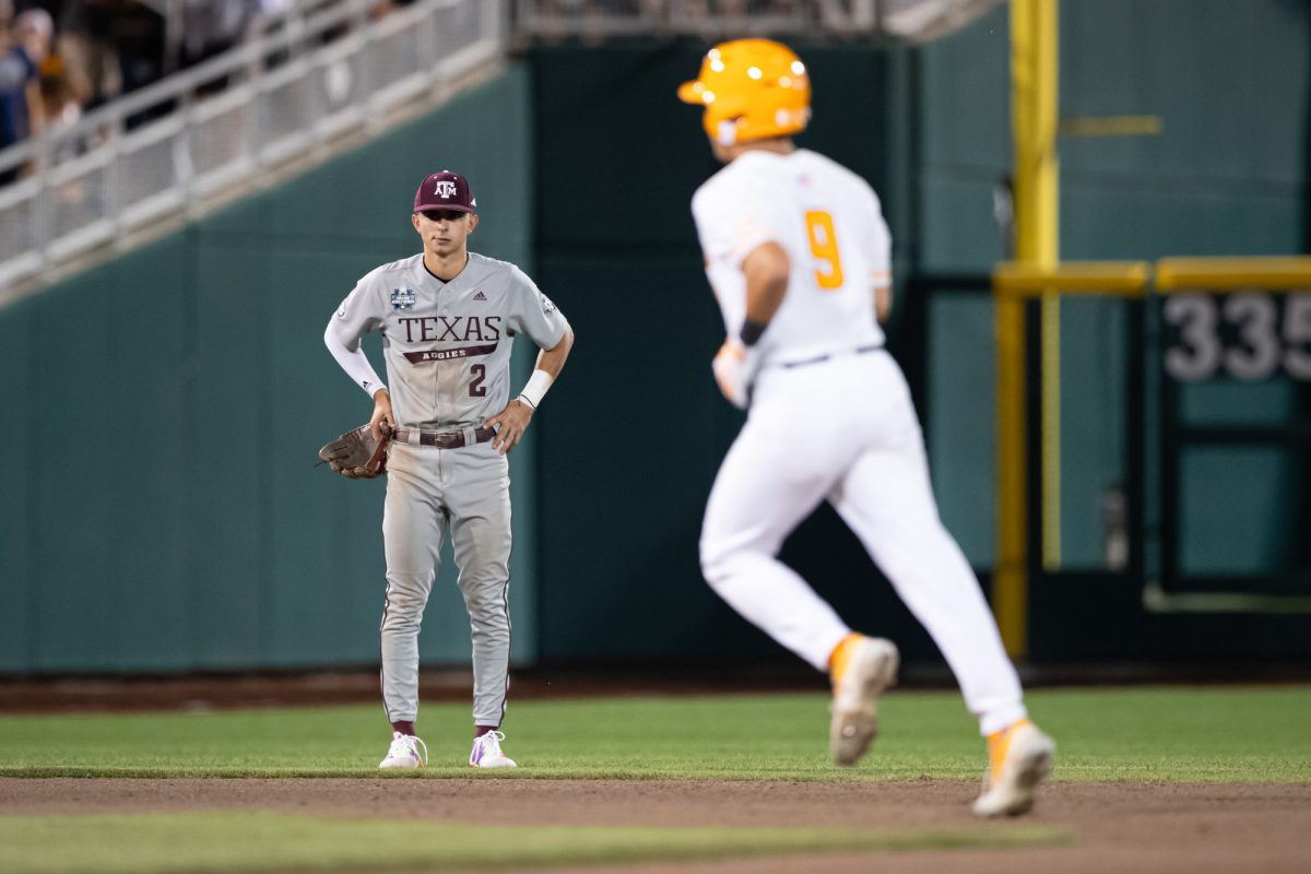 Texas A&M infielder Ali Camarillo (2) watches as Tennessee outfielder Hunter Ensley (9) round second after scoring a home-run during Texas A&M’s game against Tennessee at the NCAA Men’s College World Series finals at Charles Schwab Field in Omaha, Nebraska on Saturday, June 22, 2024. (Chris Swann/The Battalion)