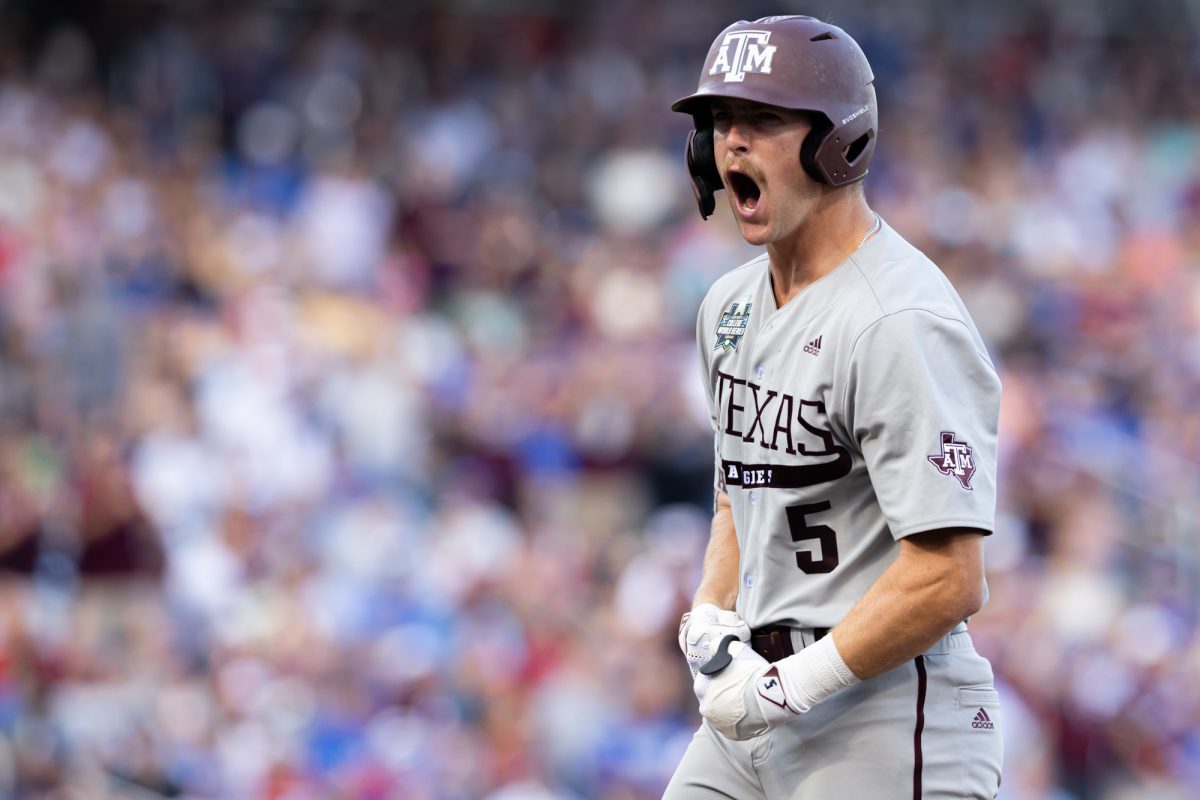 Texas A&M outfielder Hayden Schott (5) reacts after hitting an RBI single during Texas A&M’s game against Kentucky at the NCAA Men’s College World Series at in Omaha, Nebraska on Monday, June 17, 2024. (Chris Swann/The Battalion)