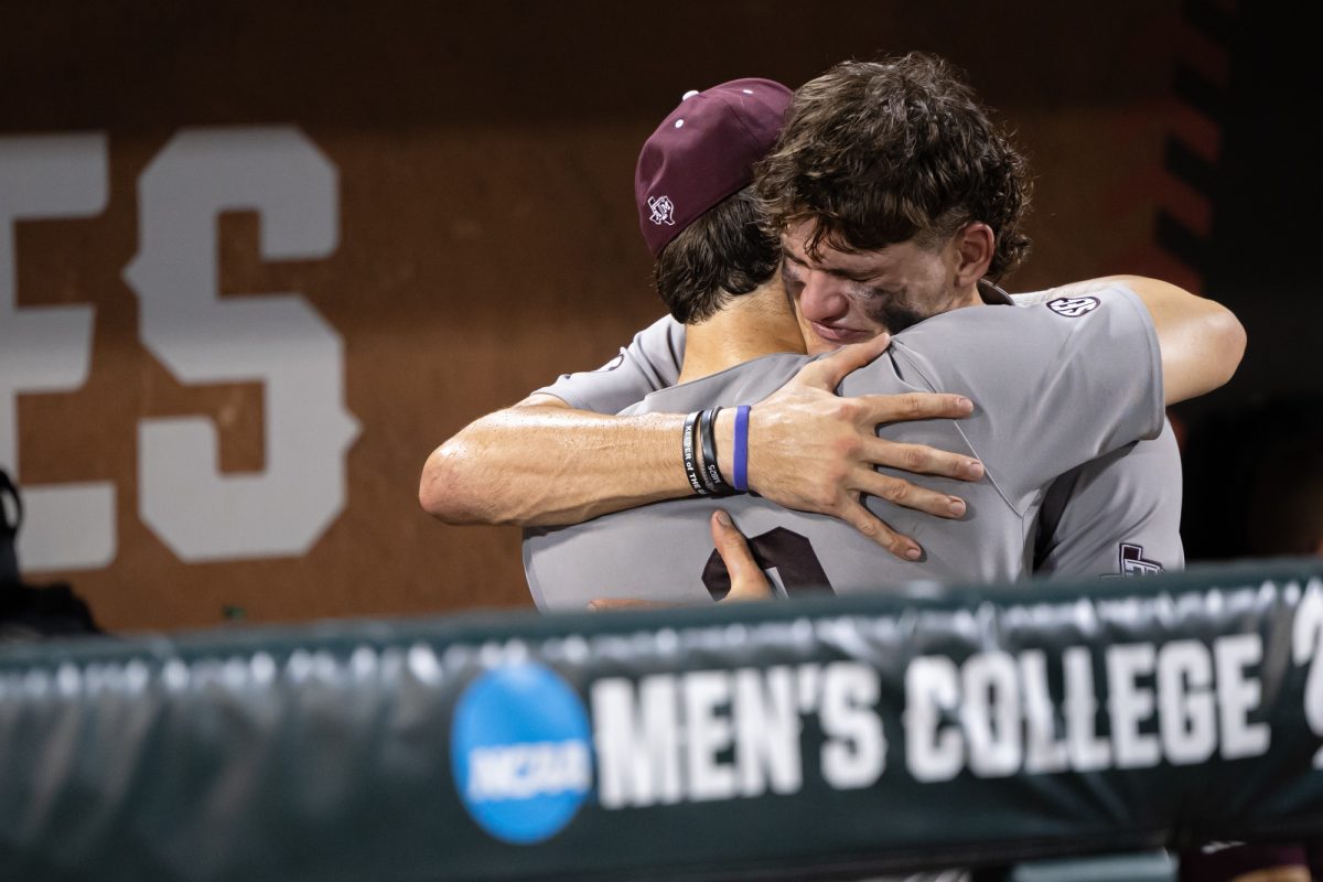 Texas A&M outfielder Jace Laviolette (17) hugs utility Gavin Grahovac (9) after Texas A&M’s loss against Tennessee at the NCAA Men’s College World Series finals at Charles Schwab Field in Omaha, Nebraska on Monday, June 24, 2024. (Chris Swann/The Battalion)