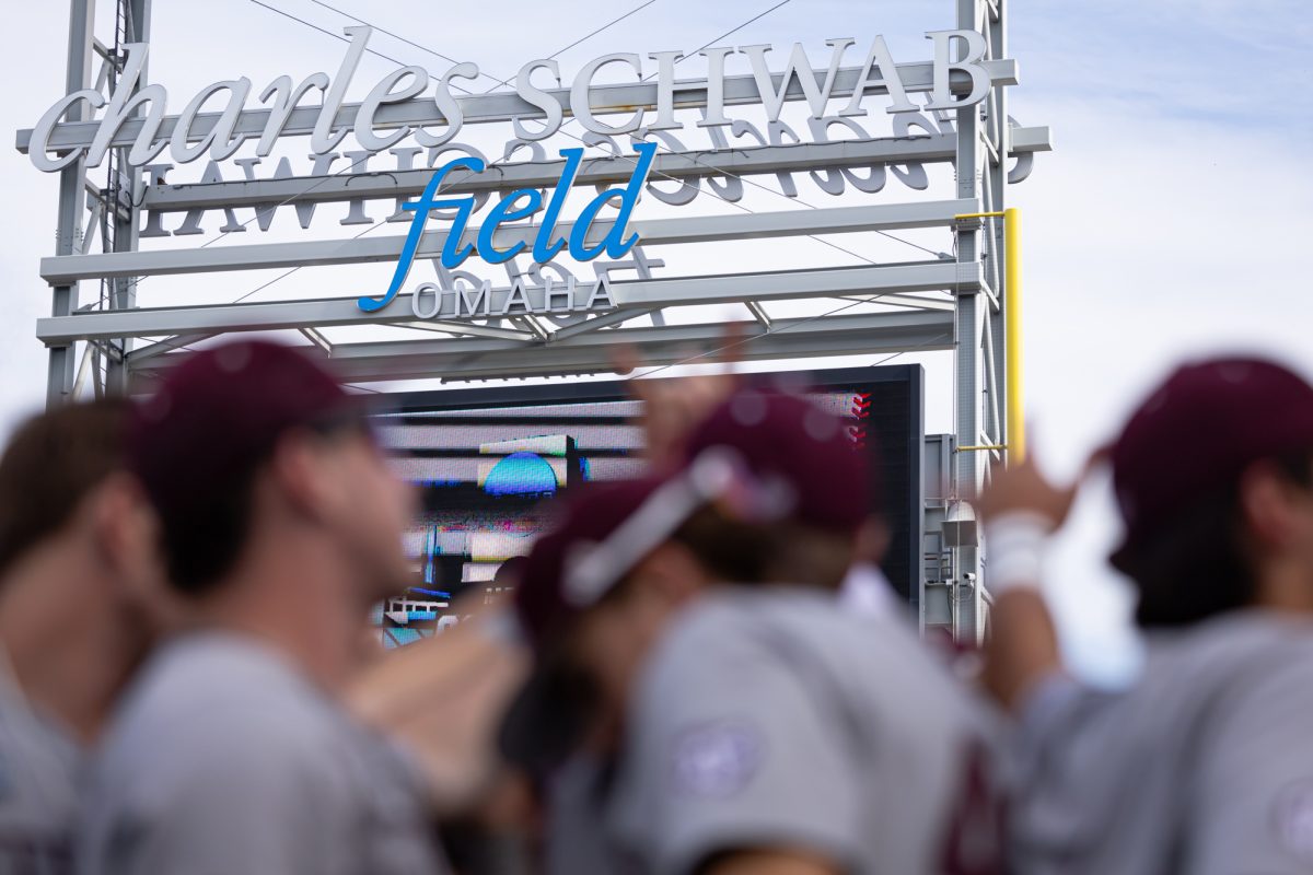 The Aggies huddle before Texas A&M’s game against Tennessee at the NCAA Men’s College World Series finals at Charles Schwab Field in Omaha, Nebraska on Saturday, June 22, 2024. (Chris Swann/The Battalion)